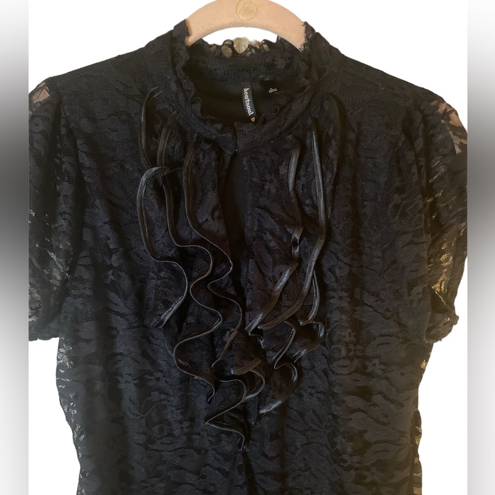 HeartSoul Lace peekaboo shirt that closes at the neck also a lining underneath.